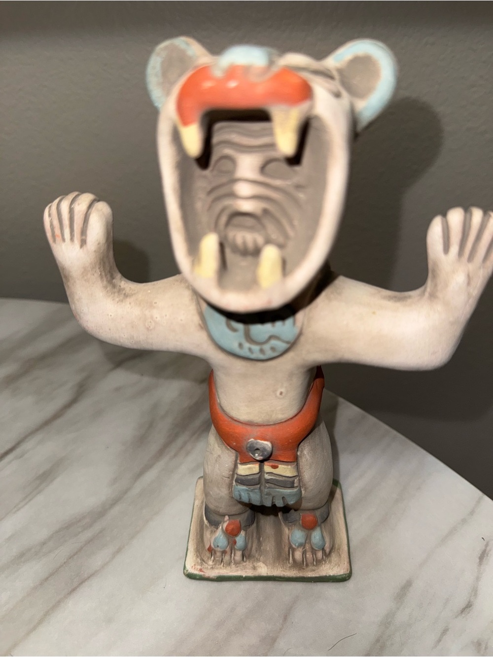 Mayan dressed in Bear ceremony dress statue